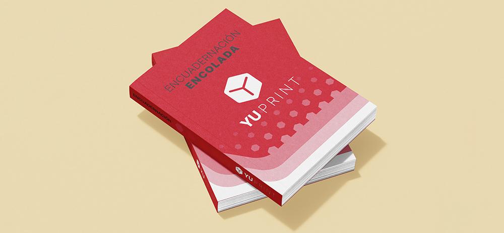 Encuadernación encolada YuPrint en portada rígida, impresión profesional y acabado premium.