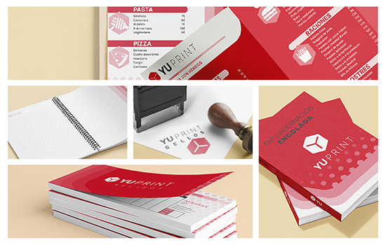 Imagen de servicios de imprenta Yuprint con tarjetas, menús, sellos, encuadernación y papelería corporativa personalizada.