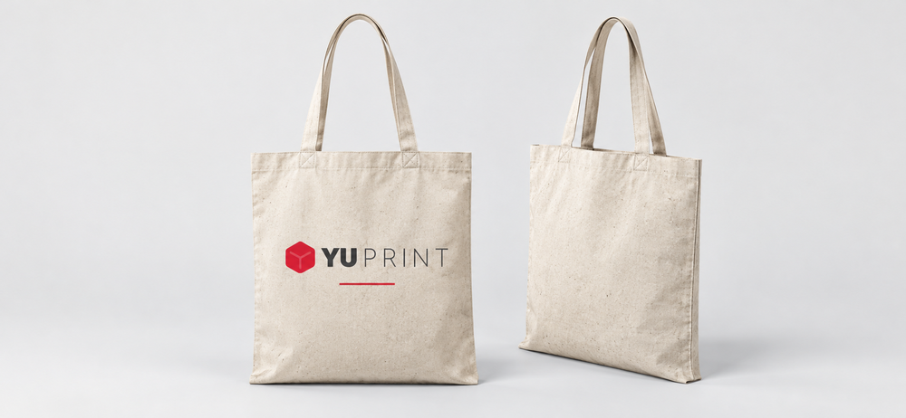 Tote bag de algodón en color natural con logo de Yuprint, presentada por delante y por detrás